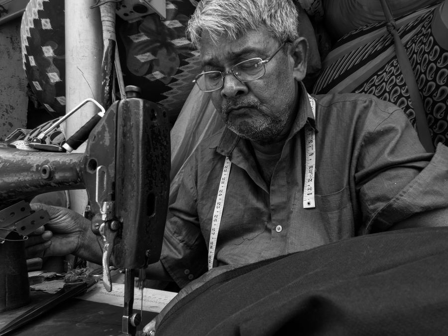 Tailor working on a sewing machine